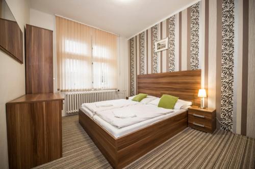 Postel nebo postele na pokoji v ubytování Apartmány u jezera Fami***