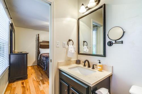a bathroom with a sink and a mirror at Pet-Friendly Roanoke Home with Fire Pit and Grill! in Roanoke