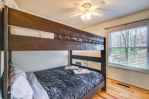 a bedroom with a bunk bed and a ceiling fan at Pet-Friendly Roanoke Home with Fire Pit and Grill! in Roanoke