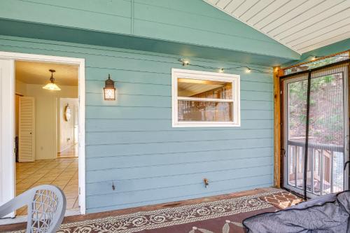 a house with a blue wall with a window at Pet-Friendly Roanoke Home with Fire Pit and Grill! in Roanoke