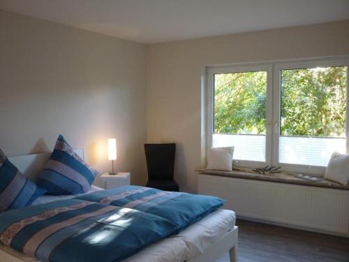 Giường trong phòng chung tại Ferienwohnung am Pfarrhof