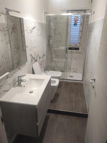 a bathroom with a sink and a shower at Marina Sea View in Marina di Gioiosa Ionica