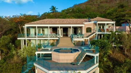 an aerial view of a house with a swimming pool at Windsong Villa - Sleeps 8 Stunning Views in Cruz Bay