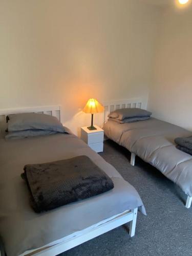 Кровать или кровати в номере The Annexe. Enniskillen Town House.