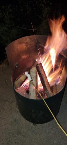 a fire in a pot with flames in it at Finca Chuchiyá cabañas Tecpan in Tecpán Guatemala
