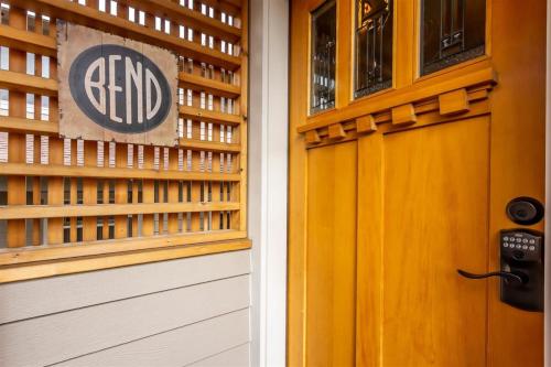 a front door of a building with a sign on it at Cumberland Bungalow walking distance to downtown in Bend