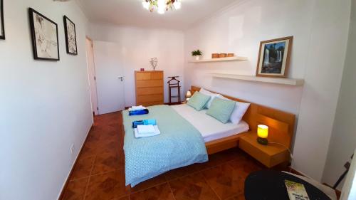 a small bedroom with a bed and a table on it at Puerto Santiago Plaza in Puerto de Santiago