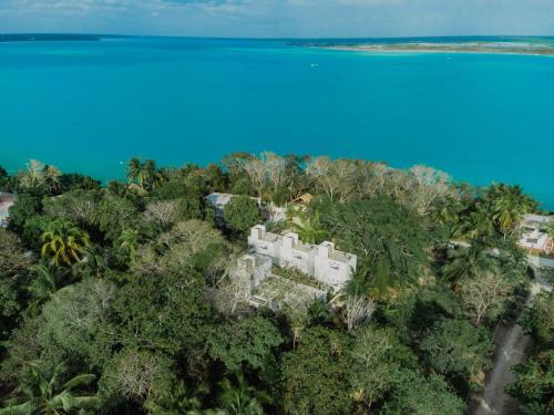 an aerial view of a resort on a tropical island at Maison Bacalar in Bacalar