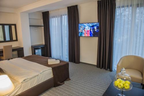 TV a/nebo společenská místnost v ubytování Bernardazzi Grand Hotel