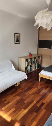 a bedroom with a bed and a book shelf at Nature in Kraków