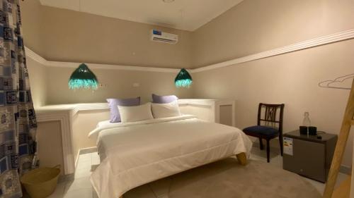 Кровать или кровати в номере Hanaia House