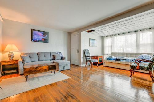 a living room with a couch and a bed at 6 Mi to Dtwn Attractions Buffalo Apartment! in Buffalo