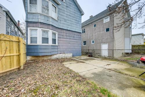 a blue house with a fence in front of it at 6 Mi to Dtwn Attractions Buffalo Apartment! in Buffalo