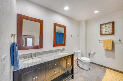 a bathroom with a sink and a toilet at Family-Friendly Lake Waubesa Home Boat and Swim! in McFarland