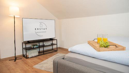a living room with a bed with a tv on it at Neue Ferienwohnung in Marl in Marl