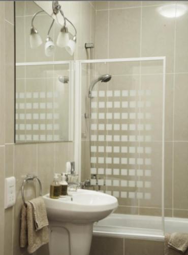 a bathroom with a toilet and a sink and a shower at Villa Dorota in Zakopane