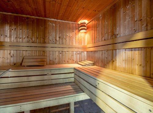 an empty wooden sauna with wooden walls and ceilings at 11 Meadow View in Newquay