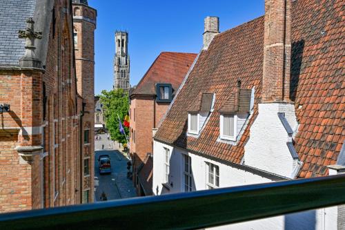 a view of a city street from a building at Grand Hotel Casselbergh in Bruges