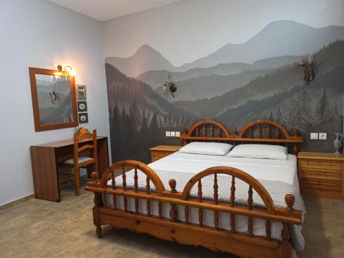 - une chambre avec un lit orné d'une fresque murale représentant la montagne dans l'établissement Zeusplace Olympous Riviera Villa 1, à Litochoro