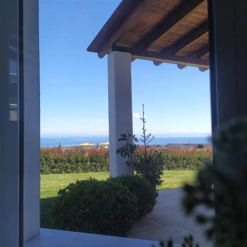 a porch with a view of the ocean at Zeusplace Olympous Riviera Villa 1 in Litochoro