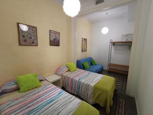 Ένα ή περισσότερα κρεβάτια σε δωμάτιο στο Fira Plaza España Apartment 3ʳᵈ Floor Balcony