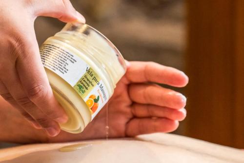a person is holding a bottle of milk at Blue Tree Thermas de Lins Resort in Lins