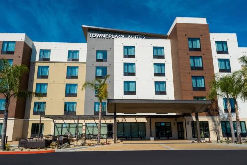 a hotel building with a sign on it at TownePlace Suites Irvine Lake Forest in Lake Forest