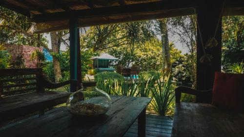 a bowl of rocks on a wooden table on a porch at Villa Mitirapa in Tohautu