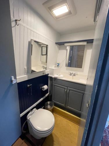a bathroom with a toilet and a sink at Updated houseboat on the river! in Fort Lauderdale