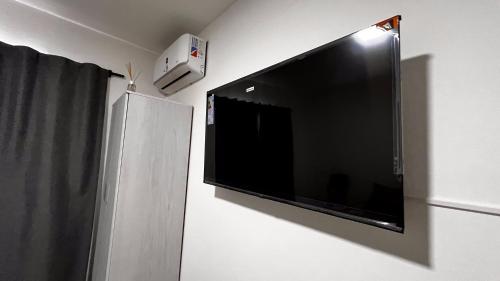 Una televisión o centro de entretenimiento en Apartamentos Mamma Mia