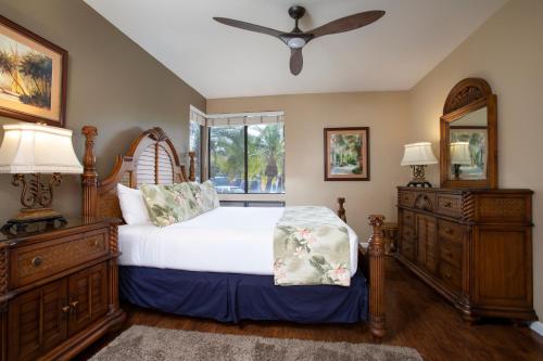 a bedroom with a bed and a window at Wailea Grand Champions Villas - CoralTree Residence Collection in Wailea