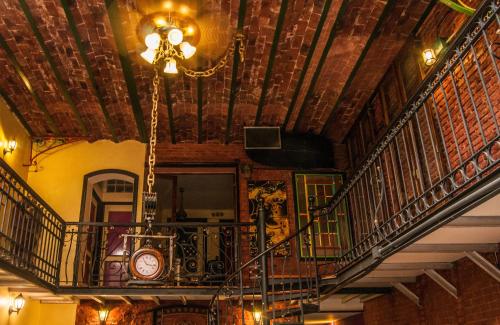 a building with a staircase and a clock on the ceiling at DEL900 Hotel Boutique in Buenos Aires
