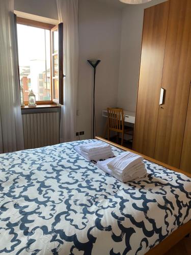 Ένα ή περισσότερα κρεβάτια σε δωμάτιο στο Casa Vignetto Biella