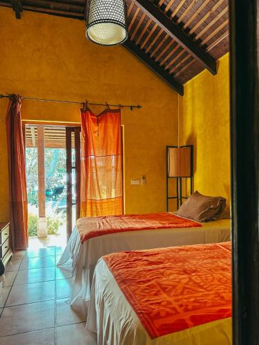 a bedroom with two beds and a window at Villa Mitirapa in Tohautu