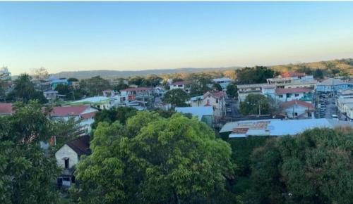 a view of a town with trees and buildings at Arnold's Guest House in San Ignacio