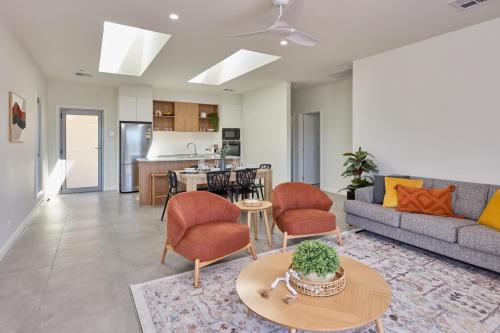 a living room with a couch and a table at BIG4 Launceston Holiday Park in Launceston