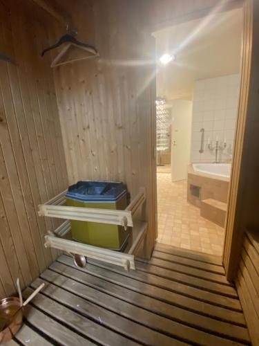 a bathroom with a tub and a sink and a toilet at Stockholm stort Rum - Dator Arbetsplats Gratis Wifi 1Gb Fiber Parkering Garderober Room2 in Täby