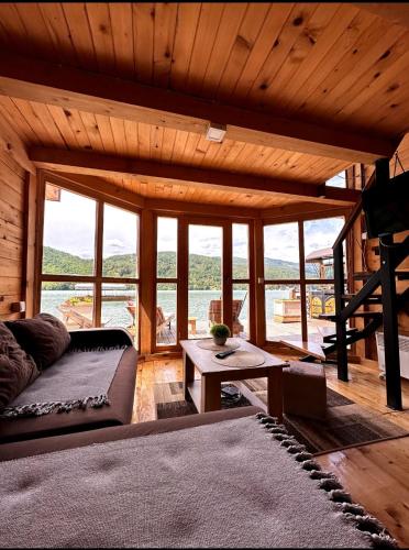 a living room with a couch and a table at Splav Horizont in Gaočići