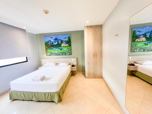 Ένα ή περισσότερα κρεβάτια σε δωμάτιο στο GH Sander Hotel