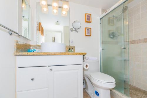 a bathroom with a toilet and a shower at Ilikai Tower 1642 Lagoon View 1BR in Honolulu