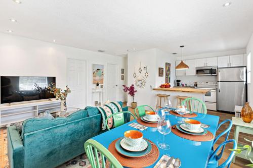 a living room with a blue couch and a table at Stylish 2 BR condo - close to Riverwalk in Fort Lauderdale