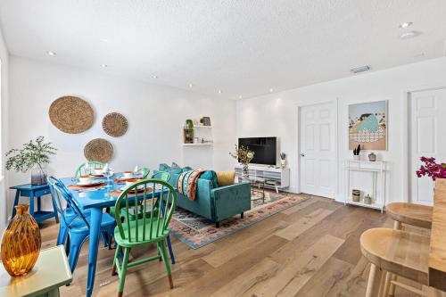 a living room with a blue table and a couch at Stylish 2 BR condo - close to Riverwalk in Fort Lauderdale