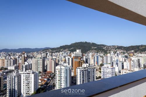 a view of a large city with buildings at TVT - Estúdios de luxo no centro de Florianópolis in Florianópolis