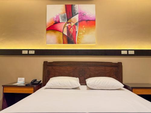 Ένα ή περισσότερα κρεβάτια σε δωμάτιο στο GH Alexander Hotel