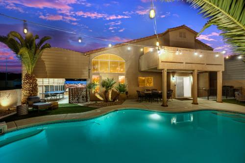 a house with a swimming pool in the yard at Heritage Haven Villa in Las Vegas
