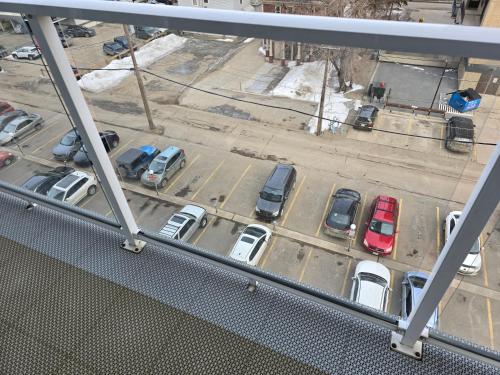 a view of a parking lot with cars parked at Smart Stylish Downtown Condo- 2 bedrooms in Saskatoon