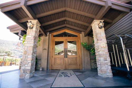 a front door of a house with a wooden door at The Ranch at Laguna Beach in Laguna Beach
