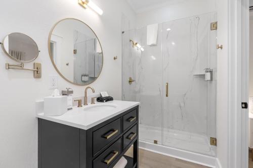 a bathroom with a sink and a shower at 27 on Park Boutique Hotel & Venue in Dahlonega
