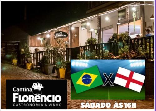 una señal con las banderas de Argentina y Brasil en Casa 2 Cantina Florêncio São Pedro da Serra en Nova Friburgo