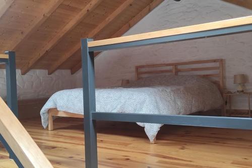 a bedroom with a bunk bed in a attic at Da Silva house in Seia